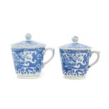 Two early 19th century pearlware custard cups and covers with printed bird and floral decoration