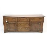 Mid-18th century oak dresser base with plank top and three frieze drawers over two central drawers