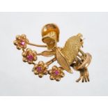 1950s novelty gold floral spray brooch in the form of a duck wearing a bonnet.