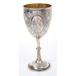 Victorian silver wine goblet with chased floral and vine leaf decoration,