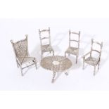 Dutch silver miniature folding table and three matching chairs (Dutch hallmarks),