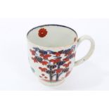 Mid-18th century English, possibly Lowestoft Imari palette coffee cup painted with tree and flowers,