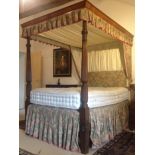 George III mahogany four poster bed with reeded uprights with stiff leaf ornament,