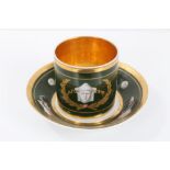 Early 19th century Paris porcelain coffee can and saucer decorated in the Etruscan style with