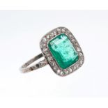 Art Deco emerald and diamond ring, the rectangular step cut emerald measuring approximately 8.