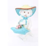 Unusual large Victorian porcelain novelty figure of a dog wearing a summer bonnet and carrying a