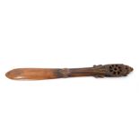 Highly unusual carved hardwood ceremonial paddle club the narrow waisted club with pierced spiral