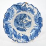 Late 17th / early 18th century blue and white Delft lobed dish with Chinese Ming-style figure in