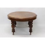Victorian mahogany extending dining table with rounded rectangular pull-out top,
