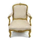 19th century carved giltwood upholstered armchair with cream silk damask upholstered pad back,