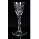 Georgian wine glass with faceted bowl and stem on splayed faceted foot,