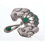 Arts and Crafts brooch by Bernhard Hertz of stylised design with green stone cabochons.