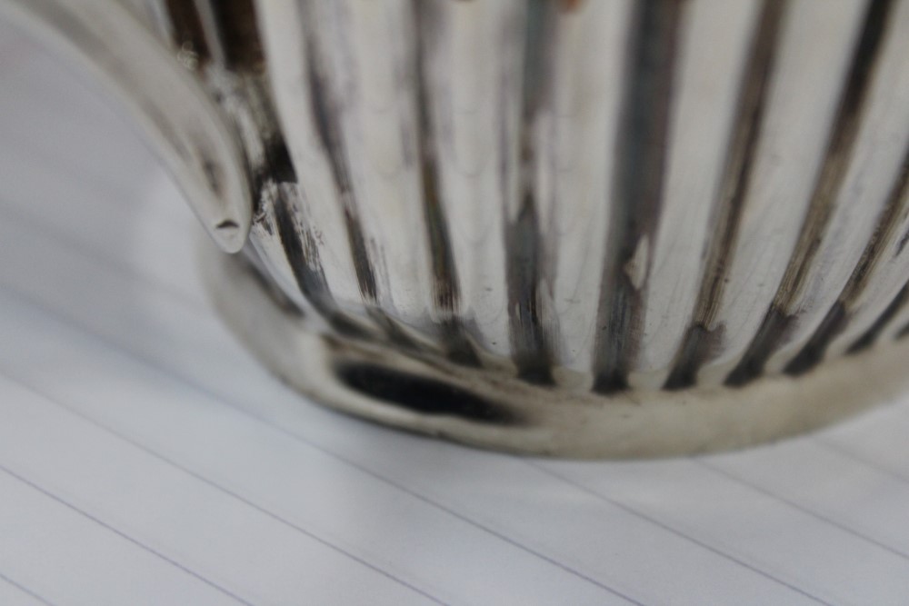 George V silver teapot of half fluted form with angular ebony handle and hinged domed and fluted - Image 10 of 13