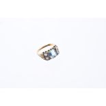 Aquamarine and diamond ring, the central step cut aquamarine weighing approximately 1.