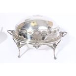 Large late 19th century silver plated two-handled revolving breakfast dish with embossed decoration,