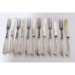 Six pairs Edwardian dessert knives and forks with steel blades and silver foliate decorated handles