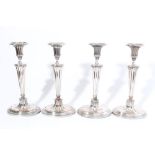 Set of four early 19th century silver plated candlesticks with fluted tapering stems,