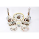 Pair of late 19th century Dresden porcelain figures with shell bowls on rococo bases, 22cm,