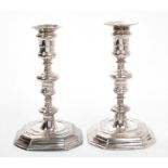 Pair of Queen Anne Britannia Standard cast candlesticks with baluster stems and spool-shaped candle