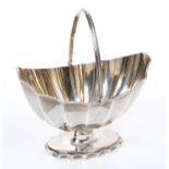 George III silver sugar basket of boat-shaped form, with silver gilt interior, fluted decoration,