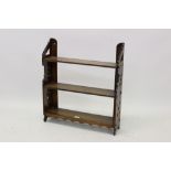 Set of 19th century Aesthetic period oak hanging shelves with pierced geometric ornament,