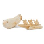 Fine 1930s Eskimo walrus ivory carving of three rowers in a canoe, 12.