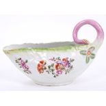 18th century Derby porcelain cabbage leaf sauce boat with polychrome floral sprays and stalk handle,