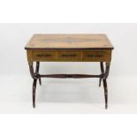 French Empire-style writing table with geometric ebonised ornament and three frieze drawers on