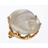 Unusual Victorian moonstone brooch with a relief carved portrait of a young boy,
