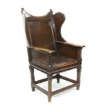 Unusual late 19th / early 20th century oak lambing chair with wing back and slip-in leather