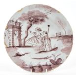 18th century English Delft manganese plate painted with Romantic scene and ruins, 23cm,