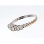 Diamond five stone ring with five graduated old cut and brilliant cut diamonds in 18ct white gold