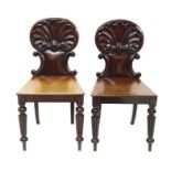 Pair of George IV mahogany hall chairs,