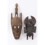 Senufo carved wooden mask, elongated form with figural final, 50cm high,