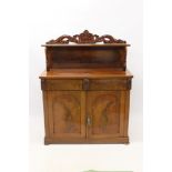 Victorian mahogany chiffonier with shelved gallery back raised on swan carved supports,