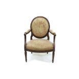 Louis XVI-style carved beech and tapestry upholstered open armchair with oval pad upholstered back,