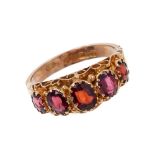 Victorian style 9ct gold and garnet five stone ring with graduated mixed cut garnets in gold scroll