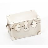 Contemporary silver pill box in the form of a travelling trunk with two handles and a hinged cover