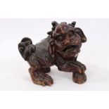 19th century Chinese red lacquered Dog of Fo with glass eyes,