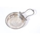 George III silver lemon strainer of circular form,