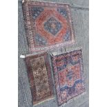 Antique Persian rug of squared form, with concentric lozenge medallion, brick red and blue ground,