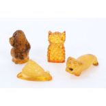 Four carved amber ornaments in the form of an owl, snail and two dogs, 3cm - 4.