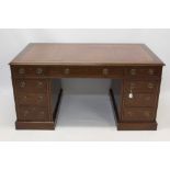 Late 19th / early 20th century mahogany pedestal desk with tooled red leather inset top and nine