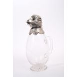 Early 20th century claret jug with silver mount in the form of a monkey's head,