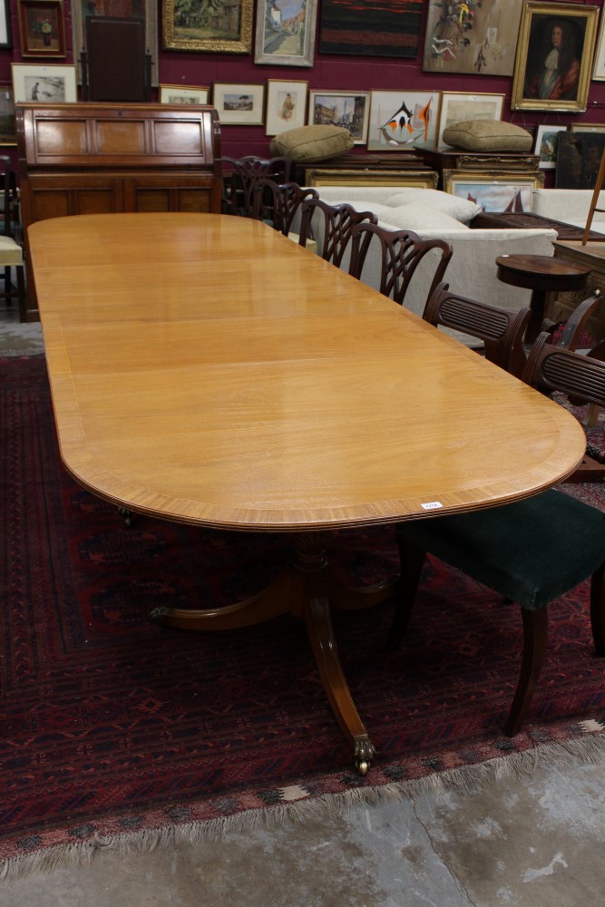 Regency-style mahogany crossbanded triple-pillar dining table by Beresford & Hicks,