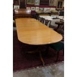 Regency-style mahogany crossbanded triple-pillar dining table by Beresford & Hicks,