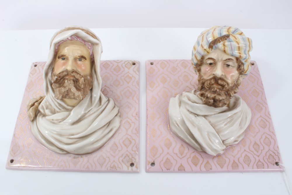 Pair of unusual 19th century French porcelain Arab head wall plaques with protruding heads on gilt