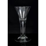 Large Georgian wine glass with trumpet bowl, plain stem with air bubble on splayed foot,
