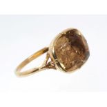 Mid-18th century high carat gold collet set foil backed citrine ring with leaf detail to the