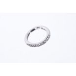 White gold eternity ring with a band of pavé set diamonds to the top.